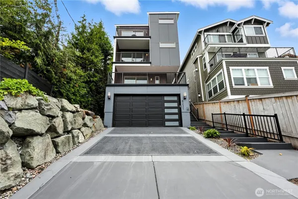 a front view of a house with a garage