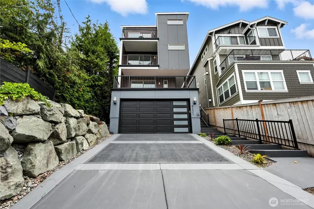 a front view of a house with a garage