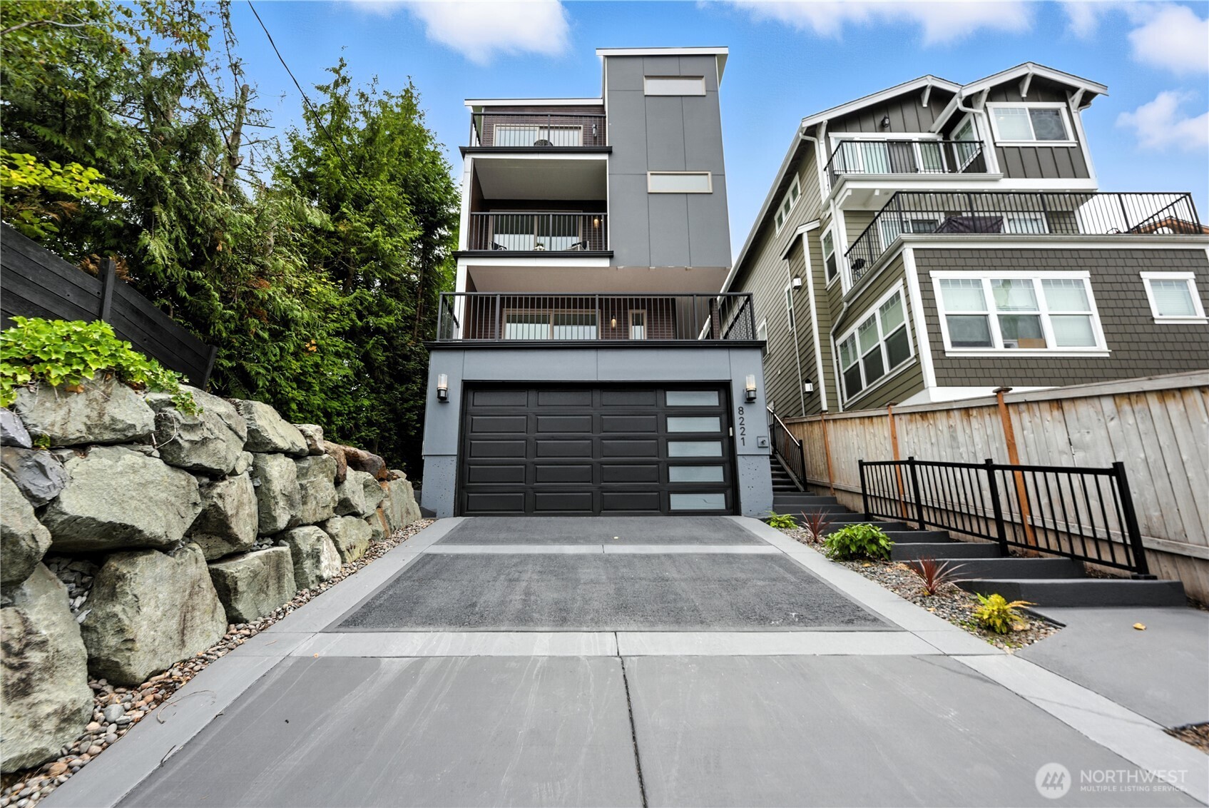 8221 South 121st Street Seattle, WA 98178 - Photo 36 of 37 a front view of a house with a garage