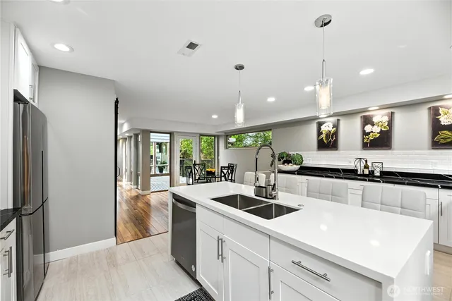 a kitchen with counter top space and stainless steel appliances