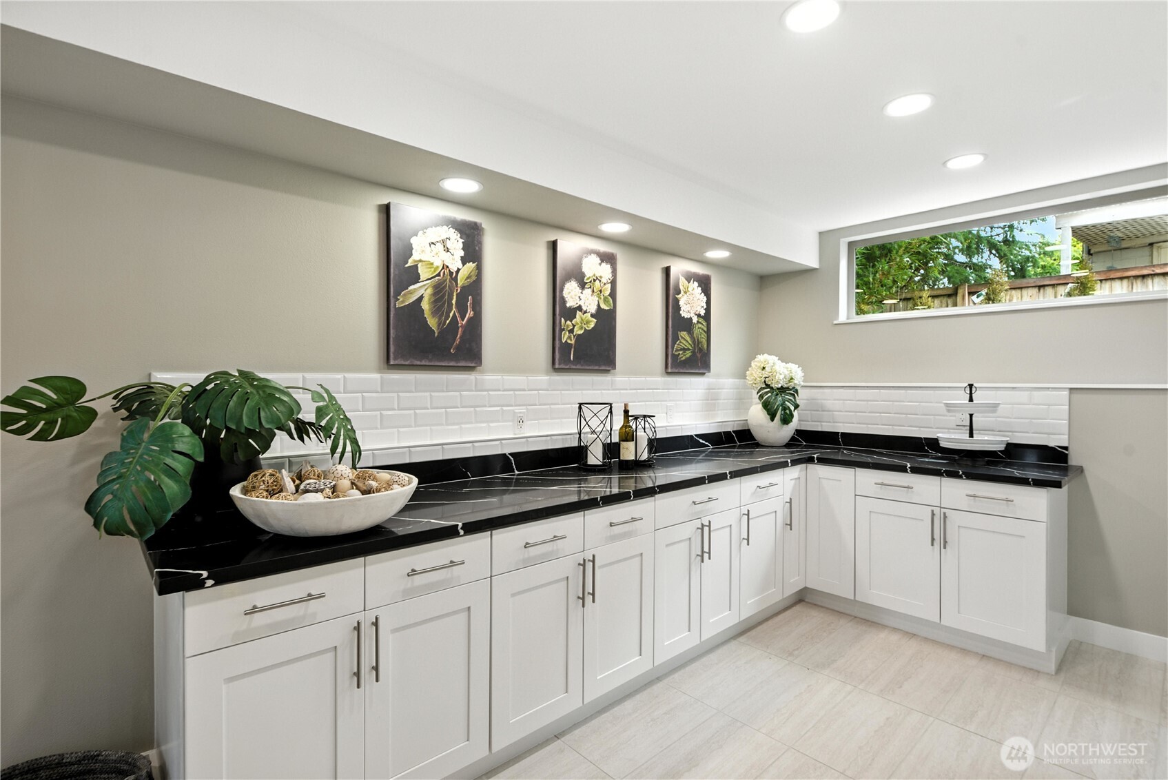 8221 South 121st Street Seattle, WA 98178 - Photo 6 of 37 a kitchen with white cabinets and a sink