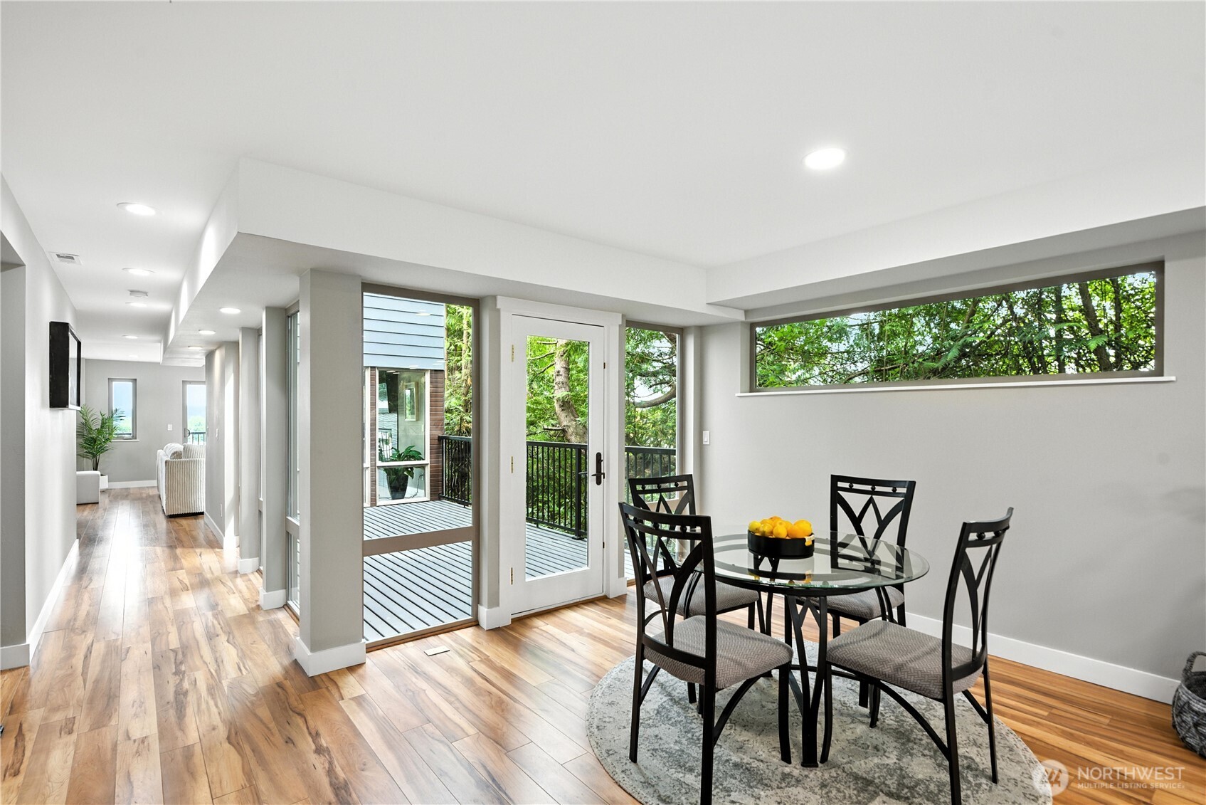 8221 South 121st Street Seattle, WA 98178 - Photo 9 of 37 a view of a dining room with furniture window and wooden floor