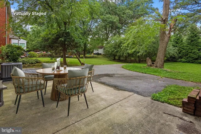 a view of an outdoor space with garden and furniture