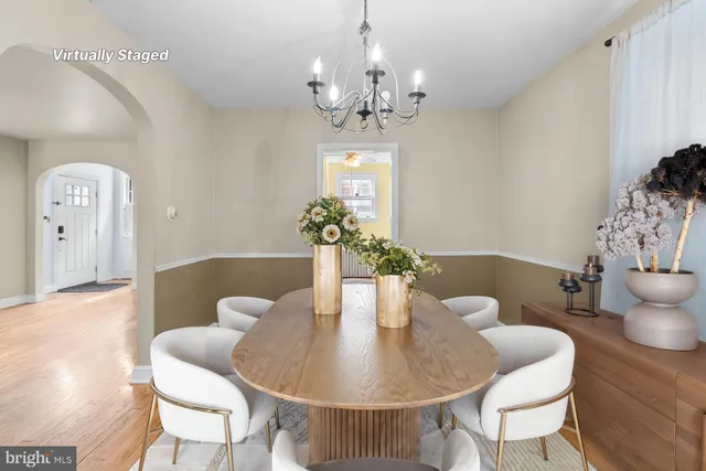 a dining room with furniture and wooden floor