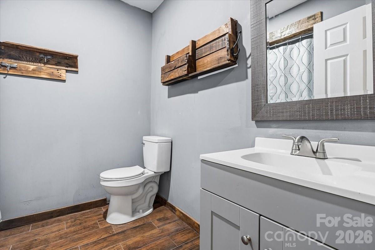 14 Jack Sullins Road Spruce Pine, NC 28777 - Photo 23 of 37 a bathroom with a sink toilet and mirror