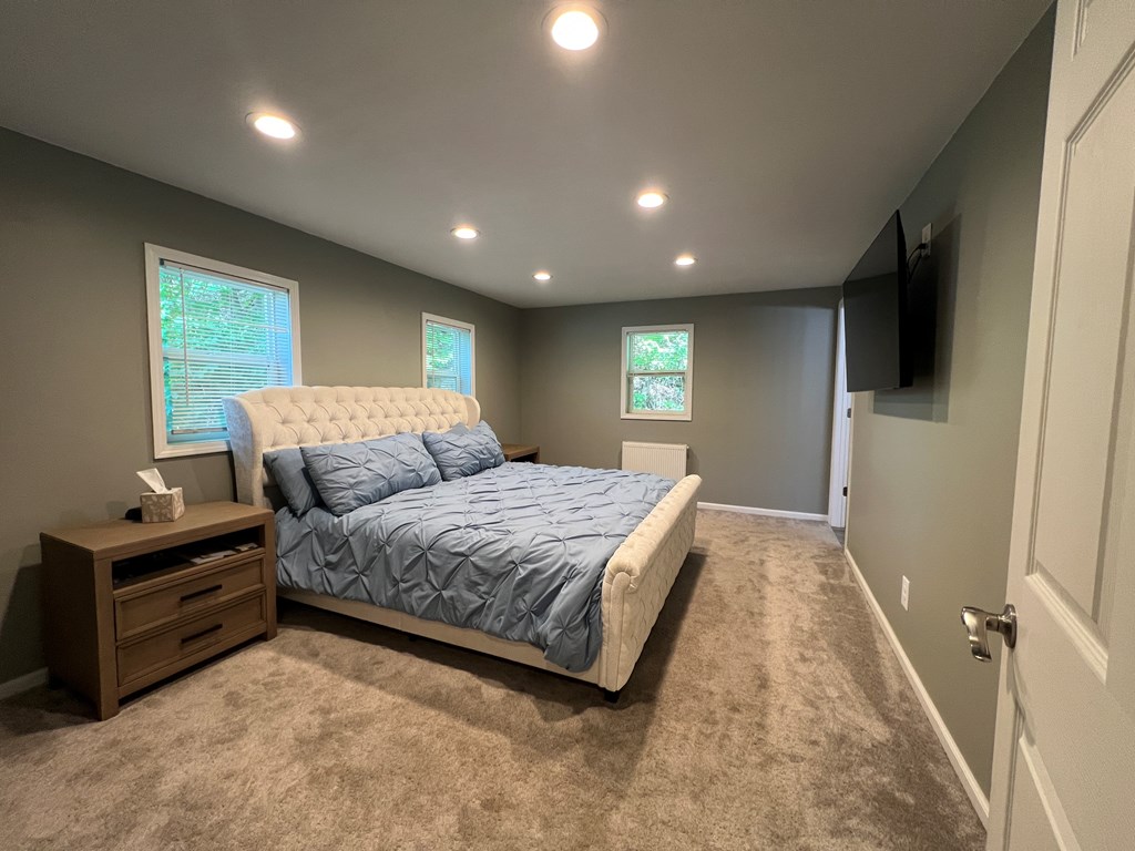 155 Cherry Run Road Rouseville, PA 16344 - Photo 9 of 19 a spacious bedroom with a bed and a flat screen tv