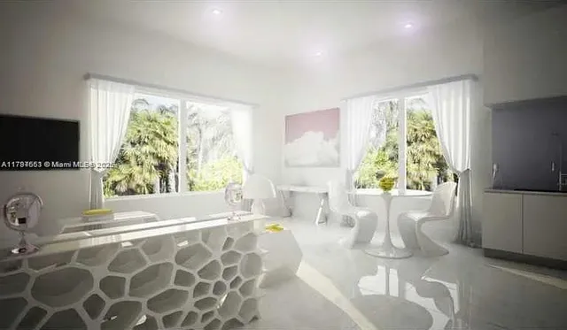 a living room with a fireplace furniture and a flat screen tv