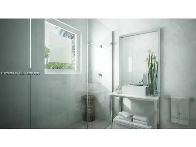 a black and white photo of a bathroom