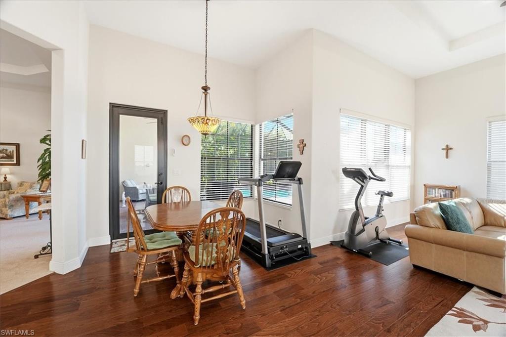 5149 Roma Street Ave Maria, FL 34142 - Photo 13 of 50 a living room with furniture and a wooden floor