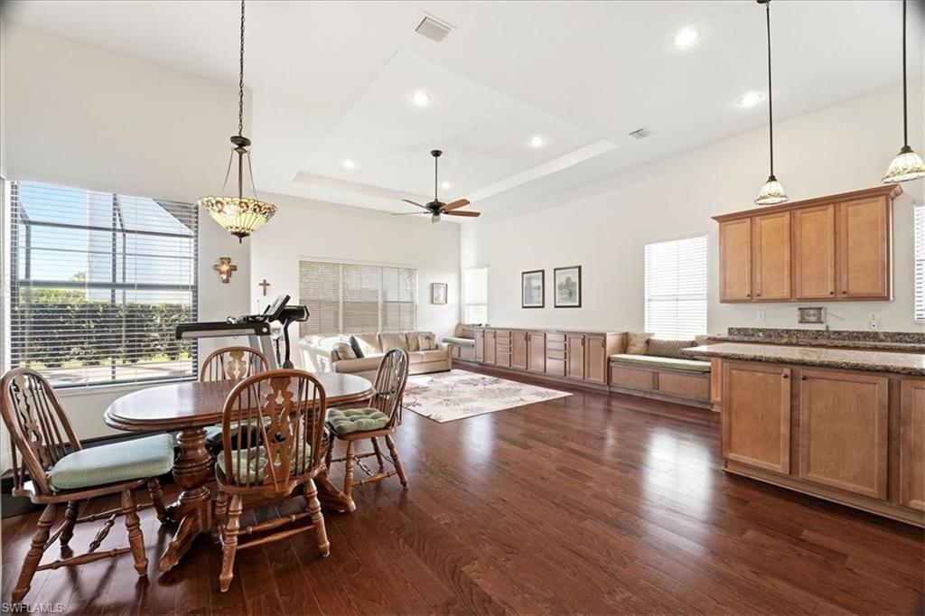5149 Roma Street Ave Maria, FL 34142 - Photo 14 of 50 a view of a dining room with furniture window and wooden floor