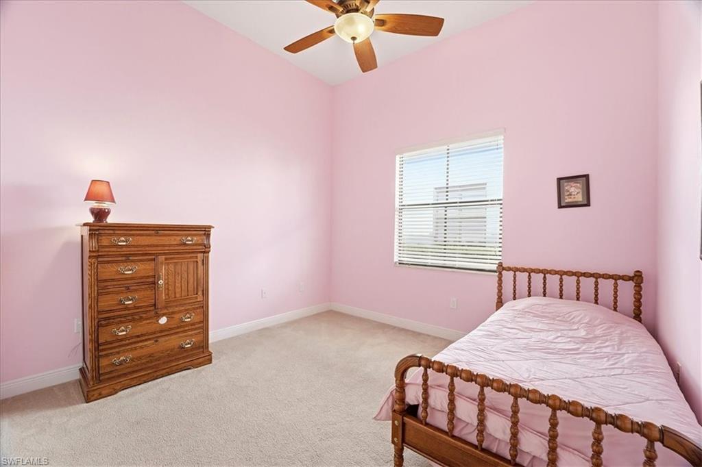 5149 Roma Street Ave Maria, FL 34142 - Photo 29 of 50 a bedroom with a bed and a dresser