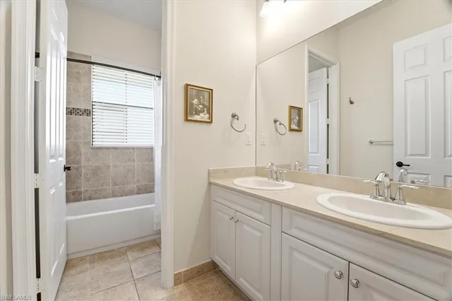 a bathroom with a sink a mirror and a bathtub