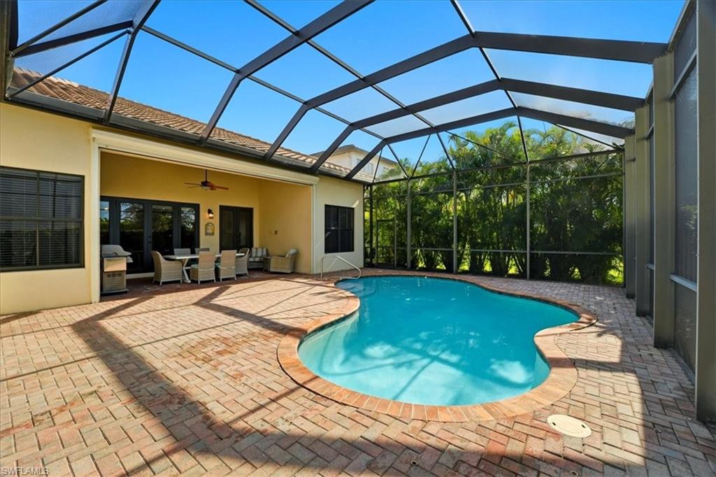 5149 Roma Street Ave Maria, FL 34142 - Photo 39 of 50 a view of a swimming pool with a patio