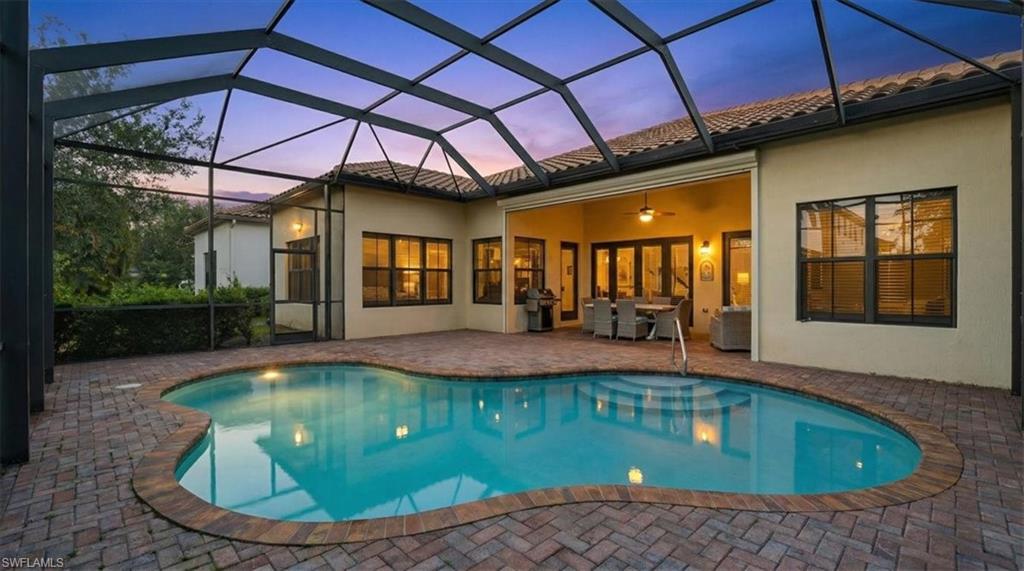 5149 Roma Street Ave Maria, FL 34142 - Photo 42 of 50 a view of a swimming pool with a patio