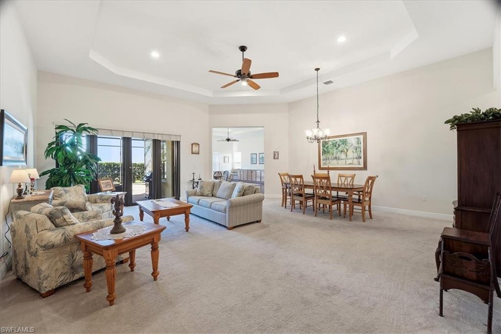 5149 Roma Street Ave Maria, FL 34142 - Photo 8 of 50 a living room with furniture and a ceiling fan