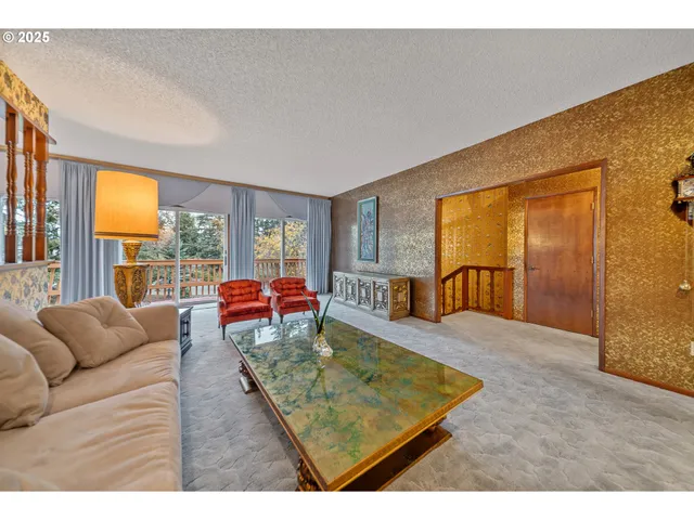 a living room with furniture and a table