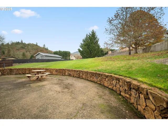 a view of a big yard with an outdoor space and seating