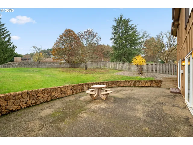an aerial view of multiple houses with a yard