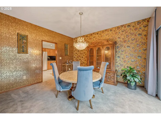a dining room with furniture and window
