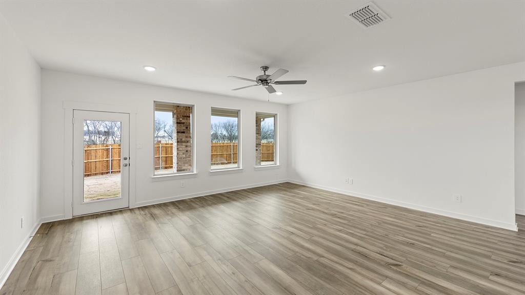 8716 Preakness Street Pilot Point, TX 76258 - Photo 9 of 24 Olive Family Room 2
