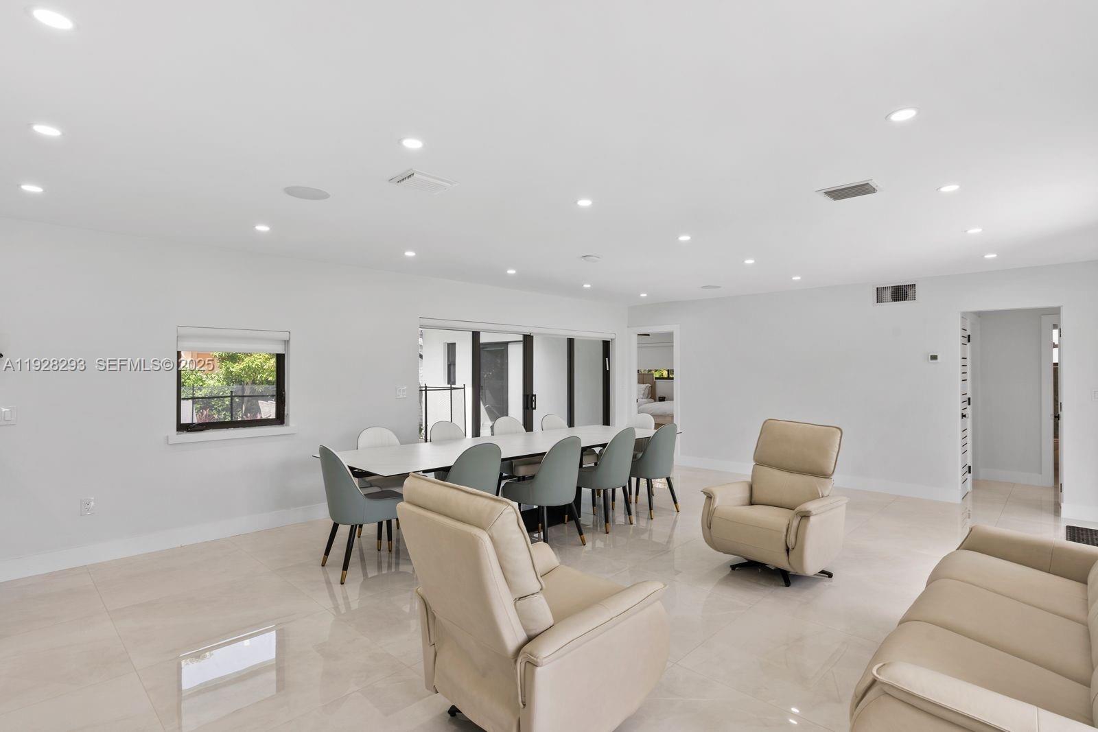 965 Northeast 171 Street Miami, FL 33162 - Photo 12 of 29 a living room with furniture and a couch