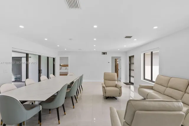 a view of living room with furniture and potted plant