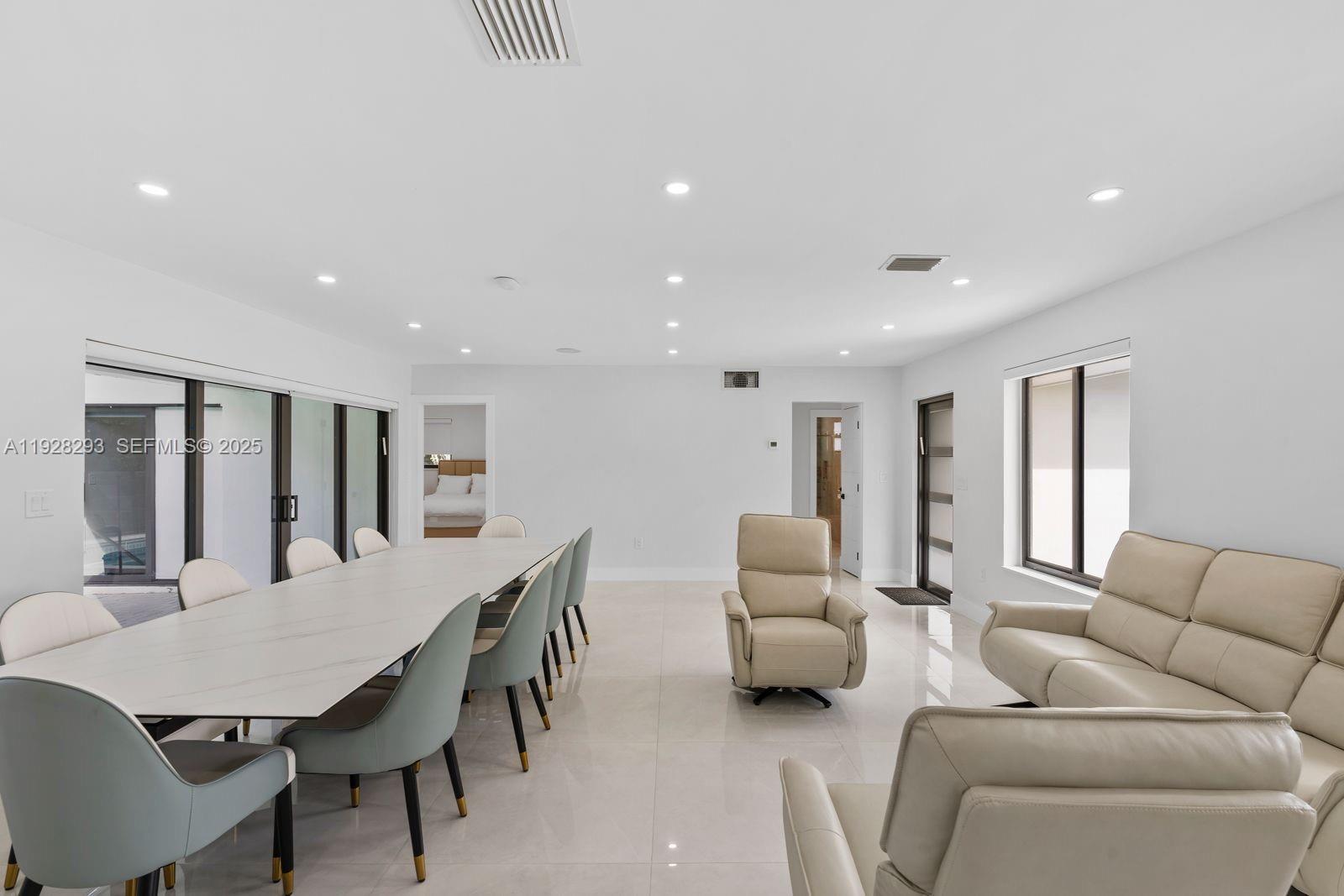 965 Northeast 171 Street Miami, FL 33162 - Photo 13 of 29 a living room with furniture and a large window