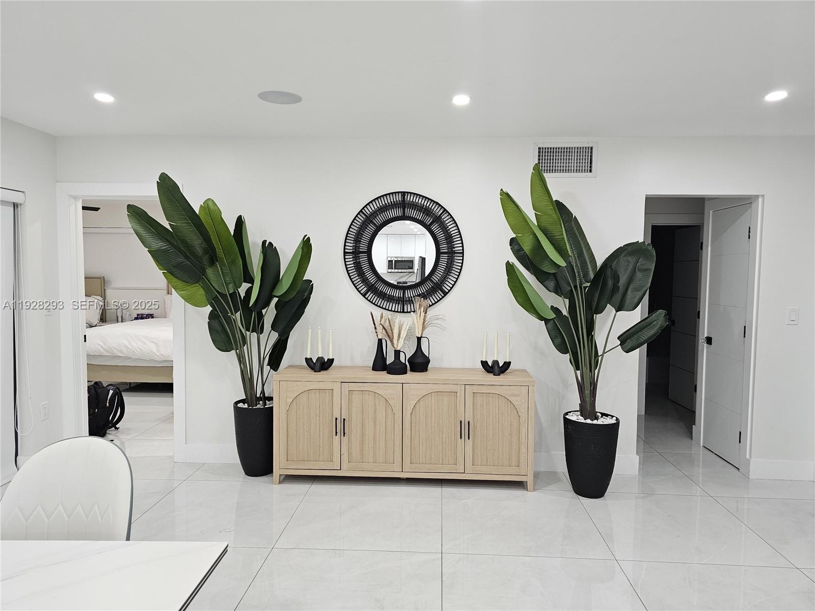 965 Northeast 171 Street Miami, FL 33162 - Photo 14 of 29 a view of living room with furniture and potted plant