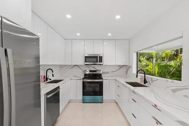 a close view of dining table chairs and a refrigerator