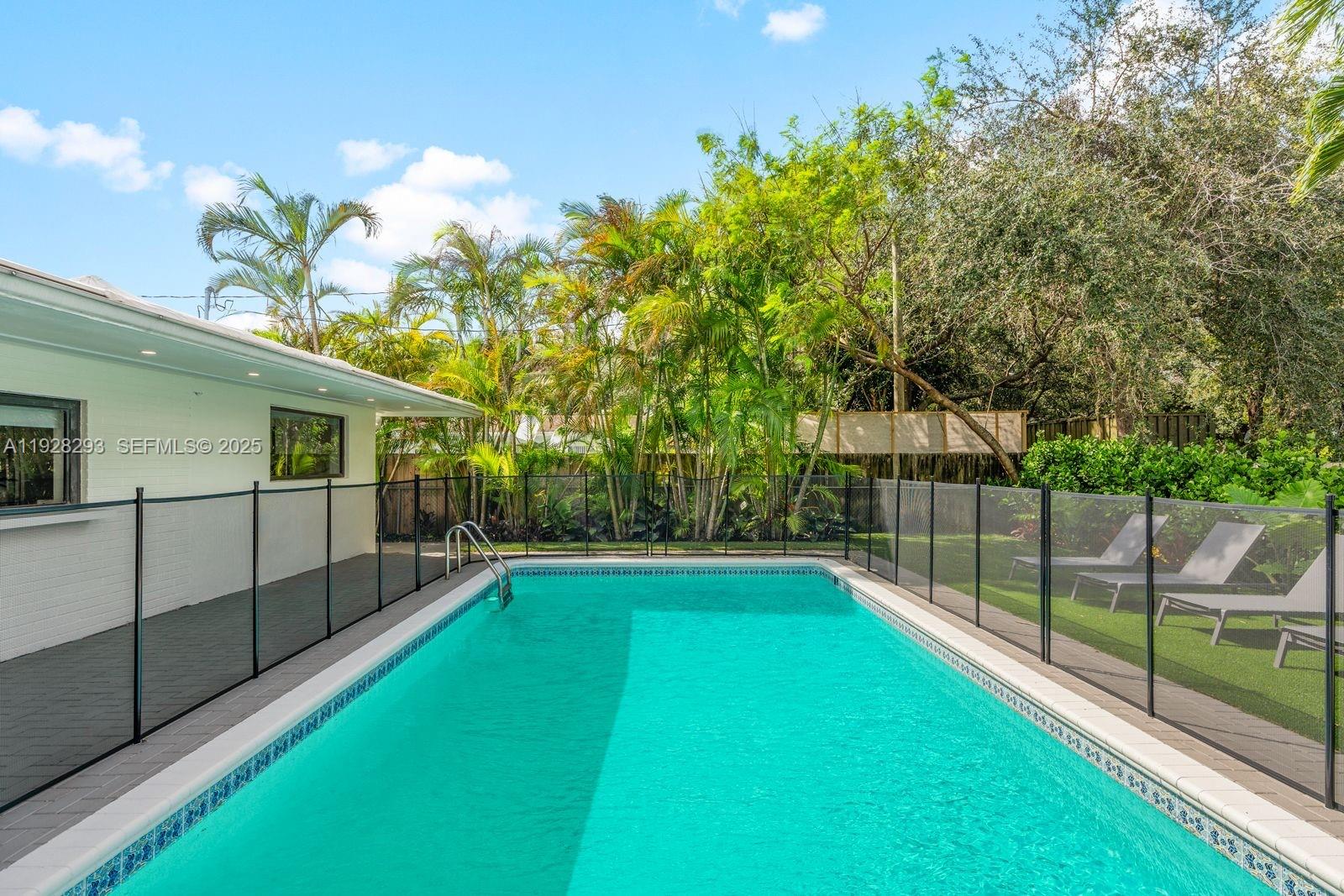 965 Northeast 171 Street Miami, FL 33162 - Photo 2 of 29 a view of a backyard with a garden