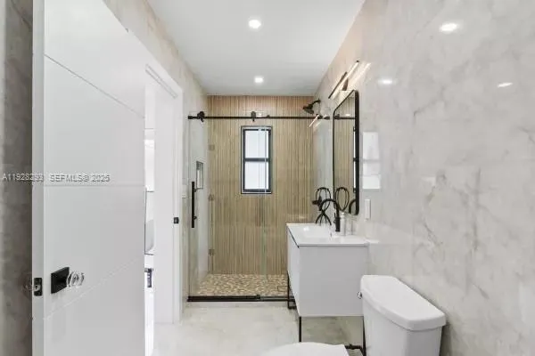 a bathroom with a toilet and a bathtub