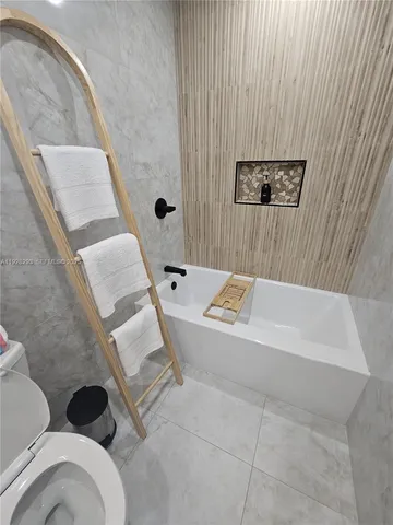 a bedroom with bed and window