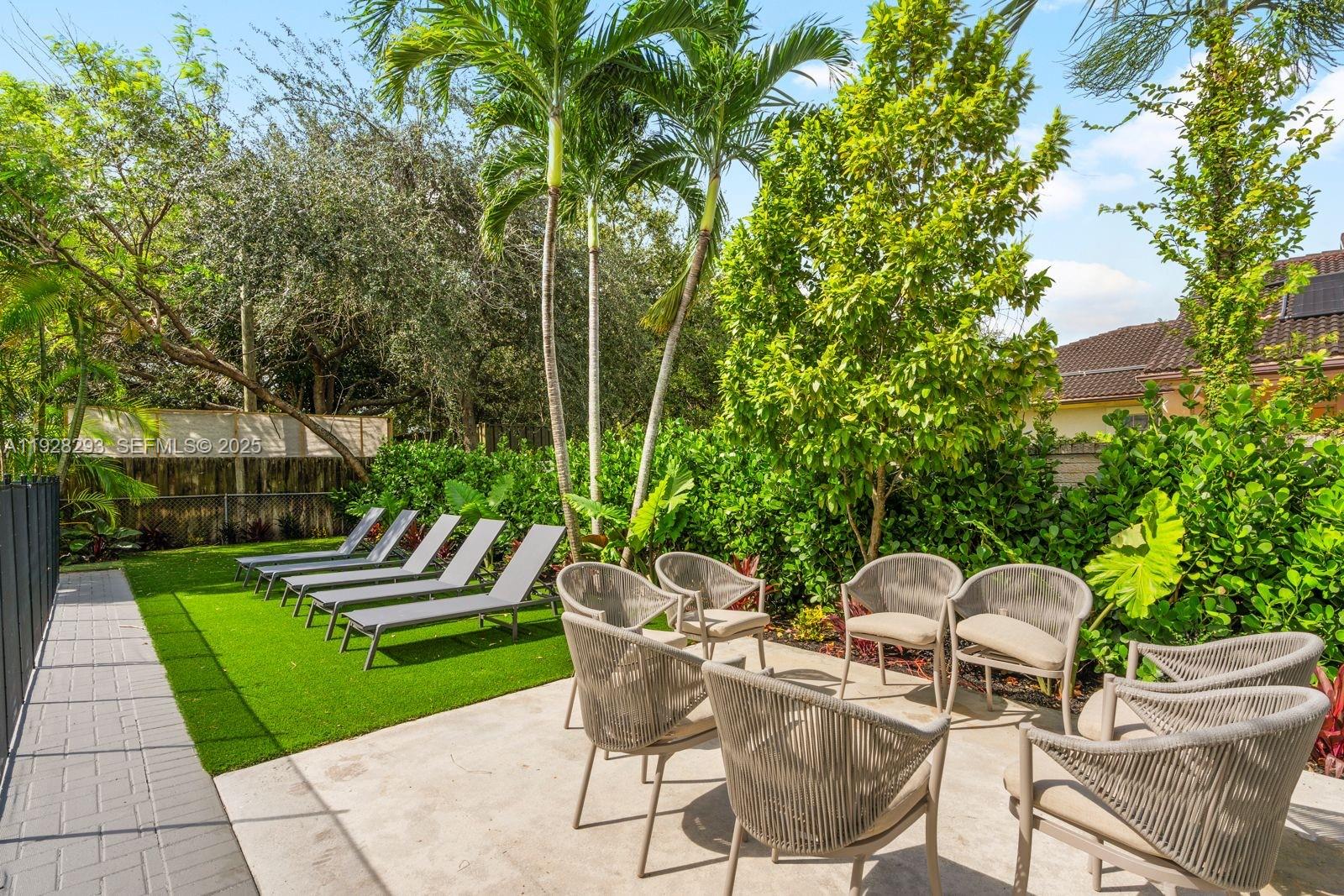 965 Northeast 171 Street Miami, FL 33162 - Photo 5 of 29 a house view with a seating space