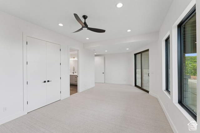 2280 East Outlaw Road, Unit 56 Kamas, UT 84036 - Photo 40 of 59 Unfurnished bedroom with light colored carpet, recessed lighting, connected bathroom, and ceiling fan