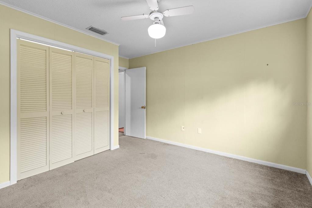 4015 Southeast 15th Street Ocala, FL 34471 - Photo 22 of 46 an empty room with a empty space and a ceiling fan