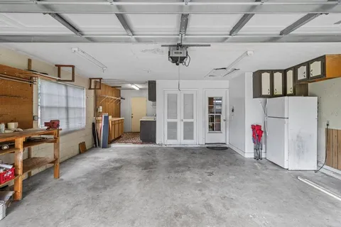 a utility room with sink dryer and washer