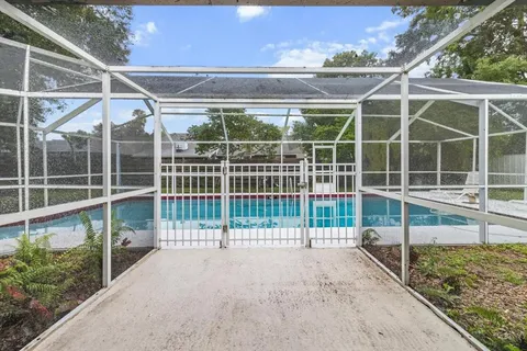 a view of a backyard with wooden floor