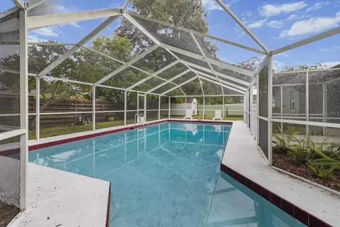 a view of a balcony with a floor to ceiling window and wooden floor