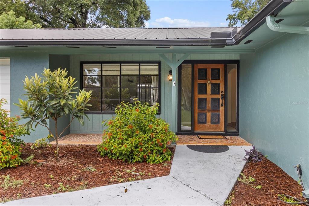 4015 Southeast 15th Street Ocala, FL 34471 - Photo 6 of 46 a front view of a house with garden
