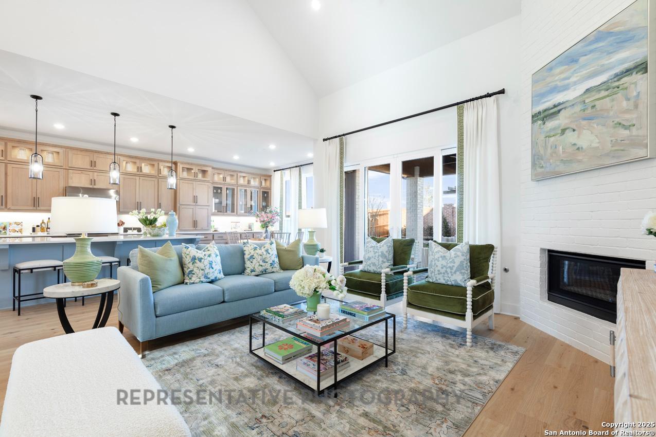 4412 Wendell Way Schertz, TX 78108 - Photo 12 of 28 a living room with furniture and a fireplace