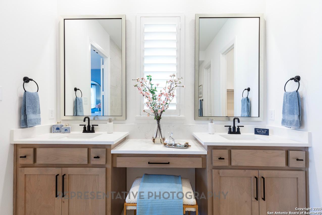 4412 Wendell Way Schertz, TX 78108 - Photo 16 of 28 a bathroom with a sink and a mirror