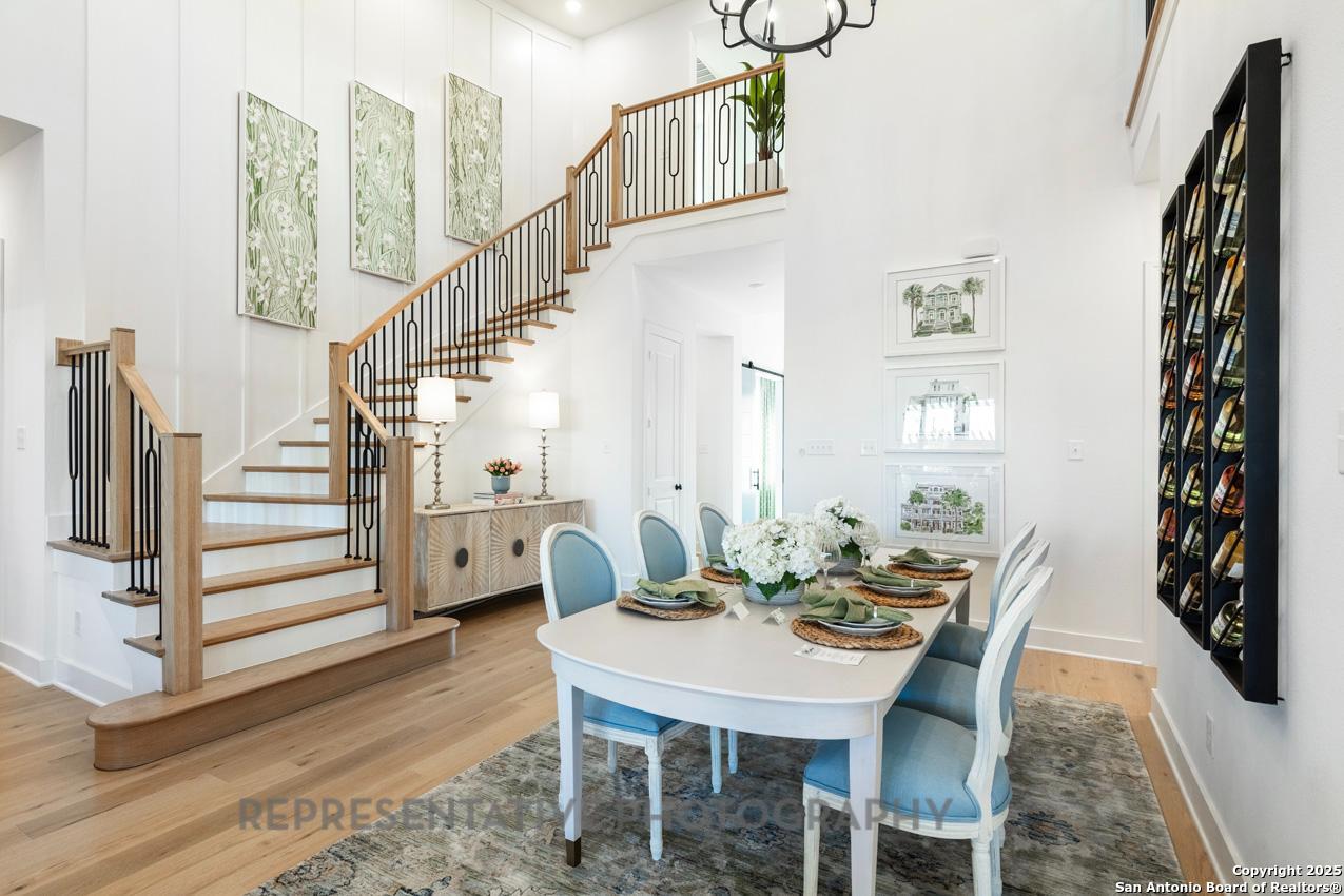 4412 Wendell Way Schertz, TX 78108 - Photo 24 of 28 a view of a dining room with furniture and wooden floor