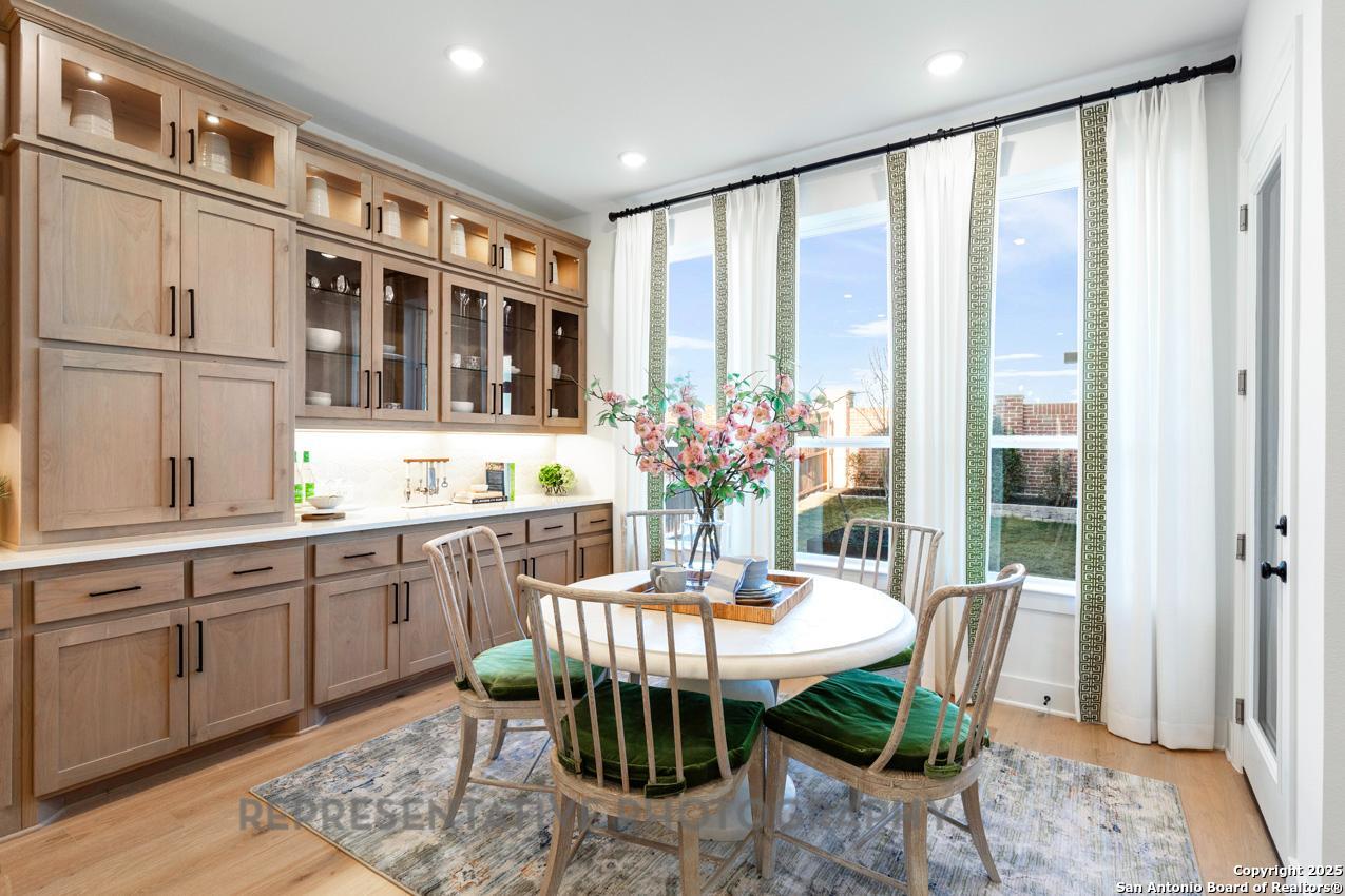 4412 Wendell Way Schertz, TX 78108 - Photo 25 of 28 a dining room with furniture window and wooden floor