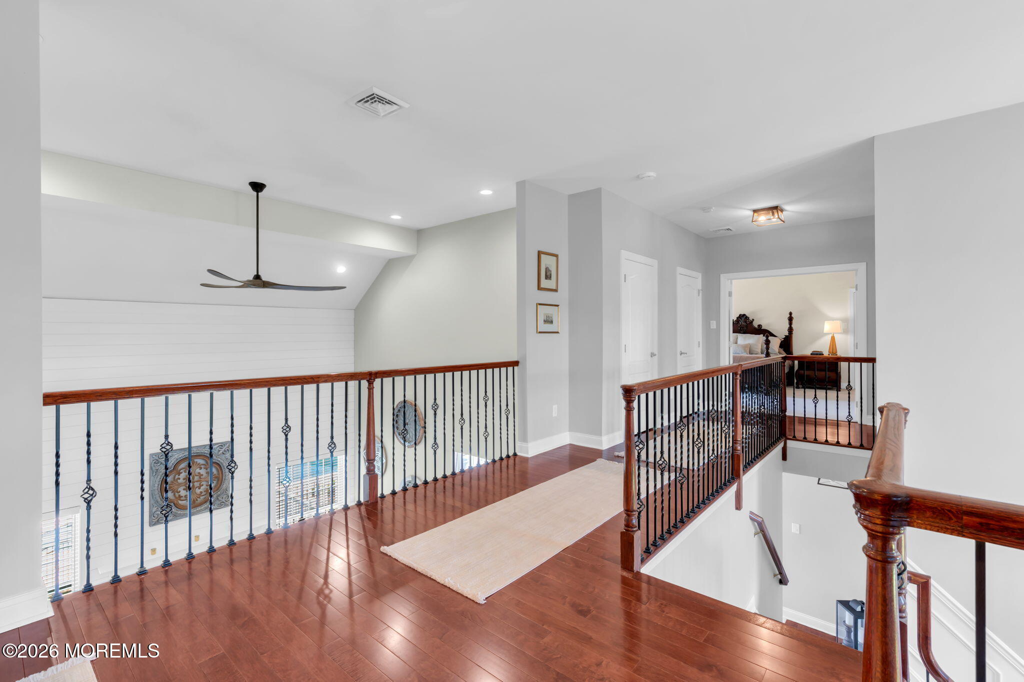 42 Ridgeview Way Allentown, NJ 08501 - Photo 22 of 47 a view of a hallway with wooden floor and windows