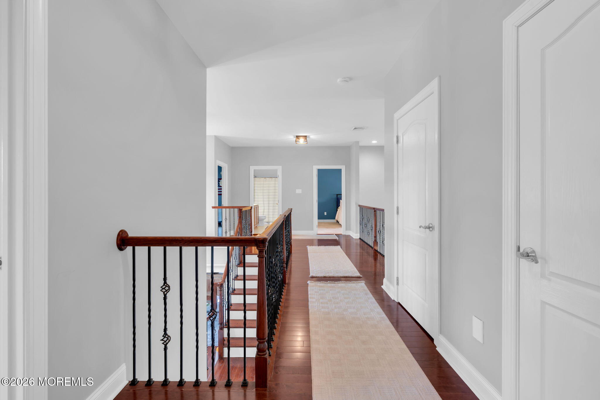 42 Ridgeview Way Allentown, NJ 08501 - Photo 23 of 47 a view of a hallway with wooden floor and staircase