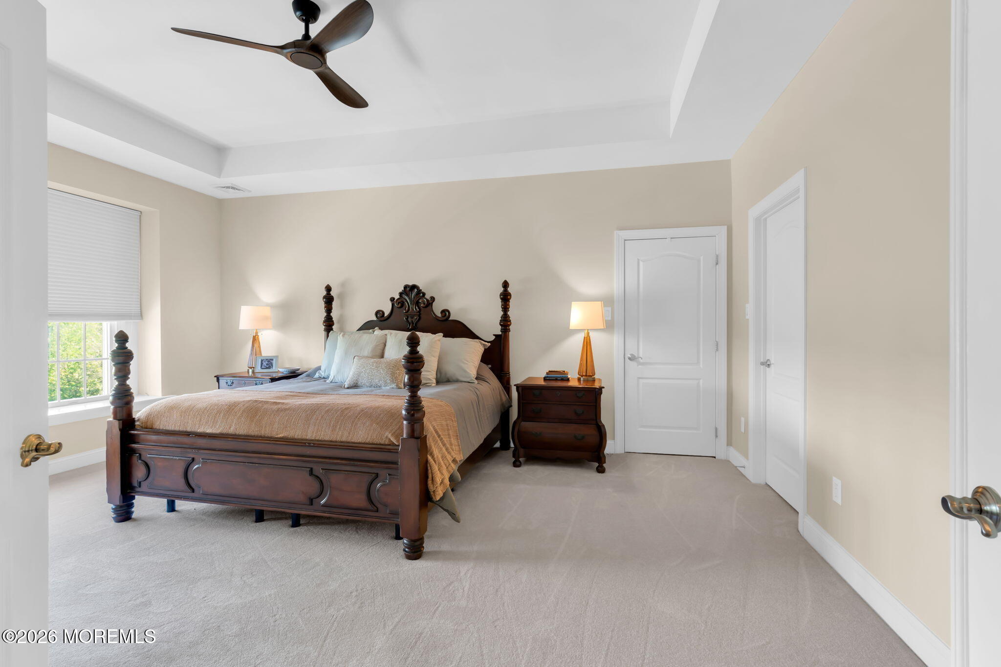 42 Ridgeview Way Allentown, NJ 08501 - Photo 24 of 47 a spacious bedroom with a bed and a chandelier