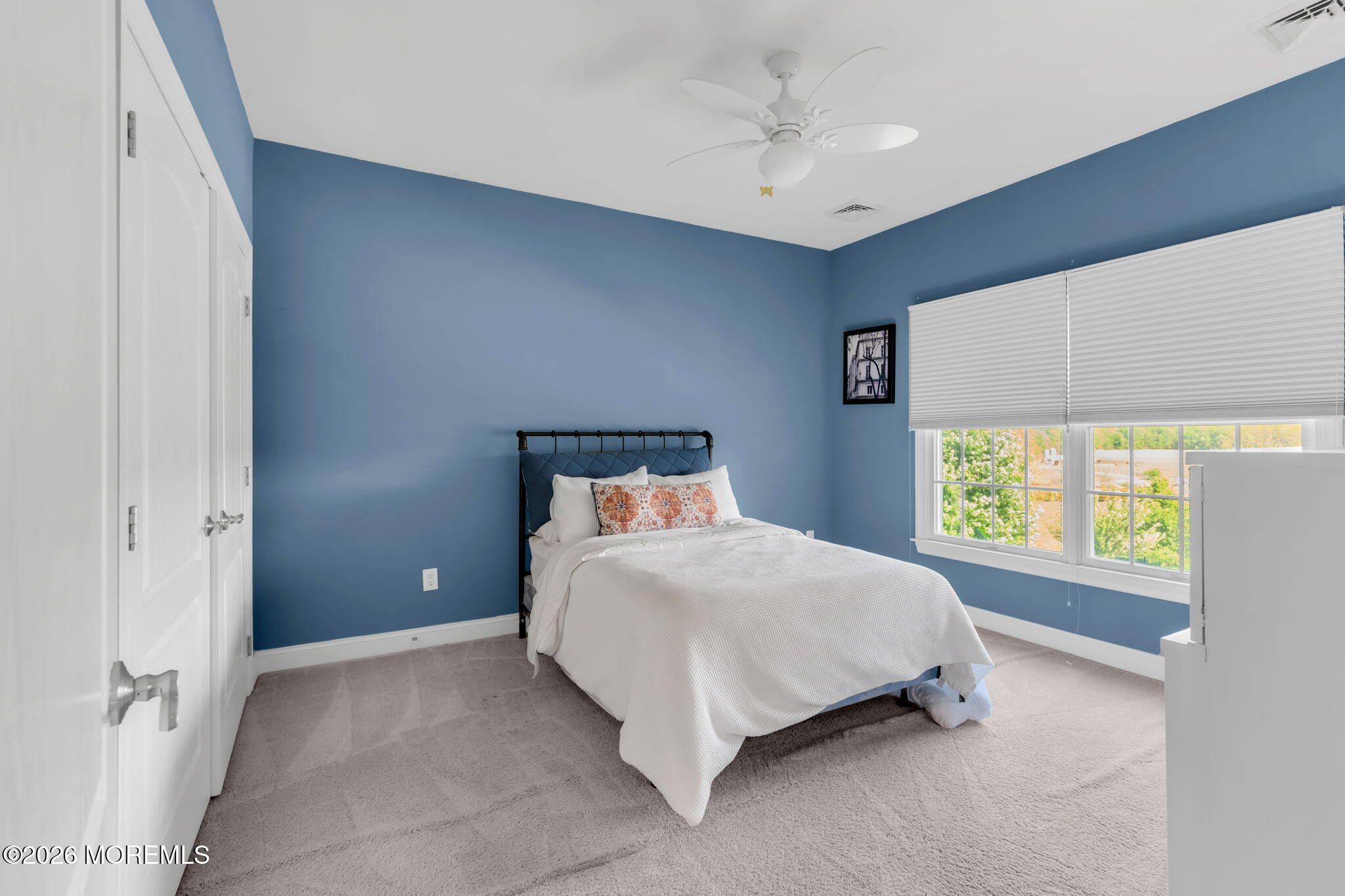 42 Ridgeview Way Allentown, NJ 08501 - Photo 29 of 47 a large bed sitting in a room next to a window