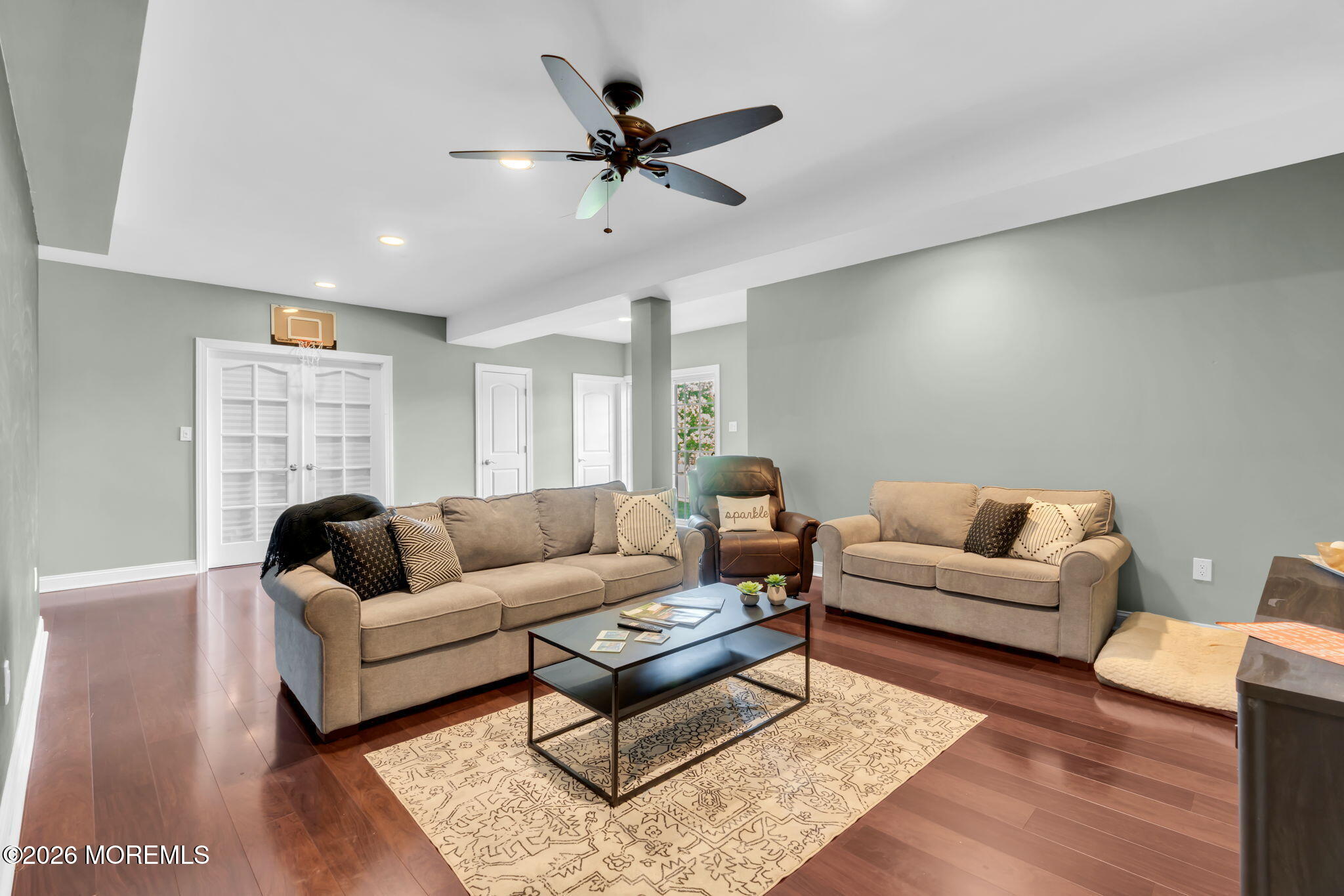 42 Ridgeview Way Allentown, NJ 08501 - Photo 38 of 47 a living room with furniture a rug and a flat screen tv