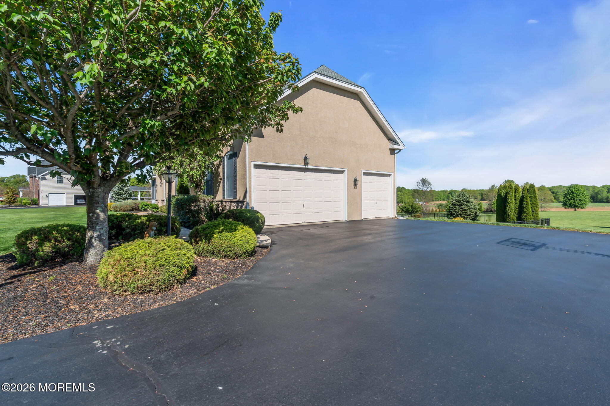 42 Ridgeview Way Allentown, NJ 08501 - Photo 47 of 47 a front view of a house with a yard and garage