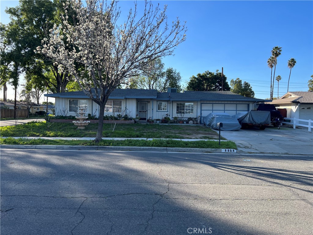 9054 Savoy Street Riverside, CA 92503 - Photo 1 of 1 a view of a house with a yard